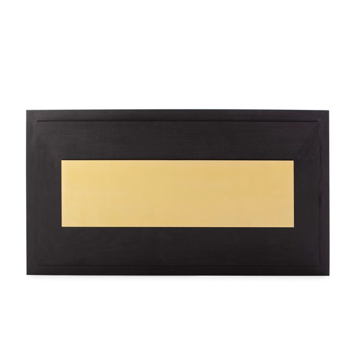 Cabecero art decó en madera negra con panel central de metal dorado.