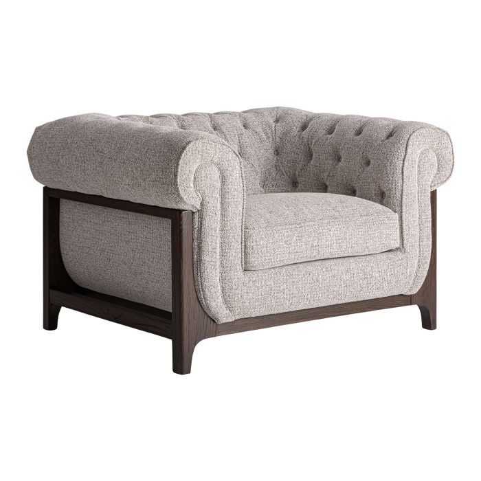 Sillón en madera de fresno marrón oscuro tapizado en tejido gris.