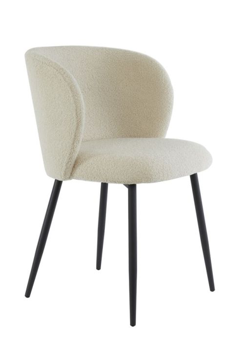 Silla de comedor moderna tapizada en tejido bouclé y patas metálicas negras.