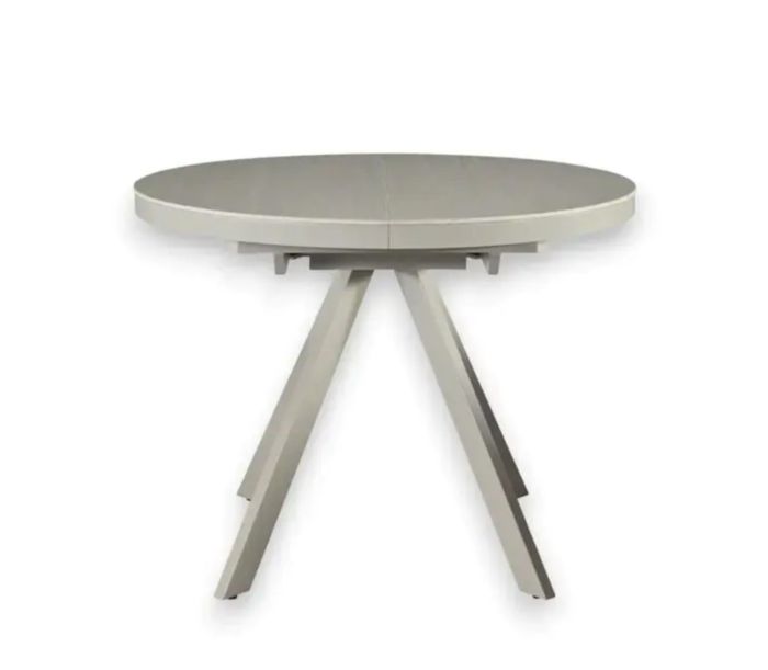 Mesa de comedor extensible en cerámica y metal blanco.