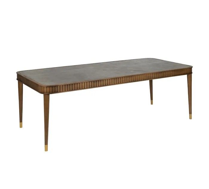 Mesa de comedor nórdica en madera mindi marrón y sobre de microcemento gris.