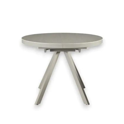 Mesa de comedor extensible en cerámica y metal blanco.
