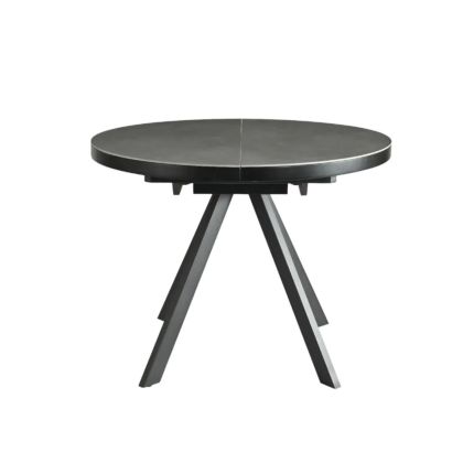 Mesa de comedor extensible en cerámica y metal gris.