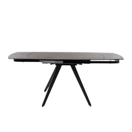 Mesa de comedor extensible en porcelánico negro.