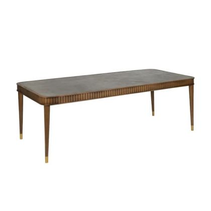 Mesa de comedor nórdica en madera mindi marrón y sobre de microcemento gris.