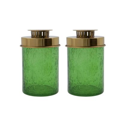 Set de 2 faroles portavelas modernos en vidrio verde con efecto burbuja con tapas de hierro latón.