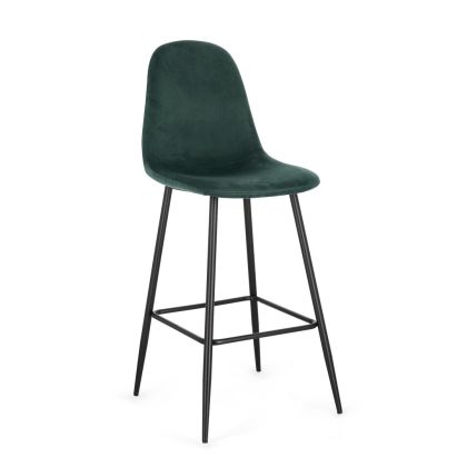 Taburete en madera tapizada en tela efecto terciopelo verde oscuro y patas de metal negro.